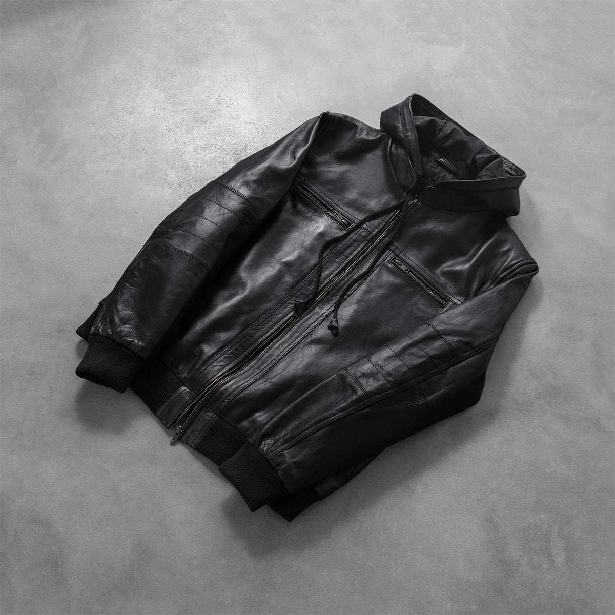 
Rib knit & Hem Craftsmanship Construction Detail on Men's Bouncer Biz Black Leather Hooded Bomber Jacket