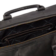
Solid Antique Brass Hardware & Heavy-Duty Dual Zipper Detail on Portsmouth Full-Grain Leather Weekender Bag