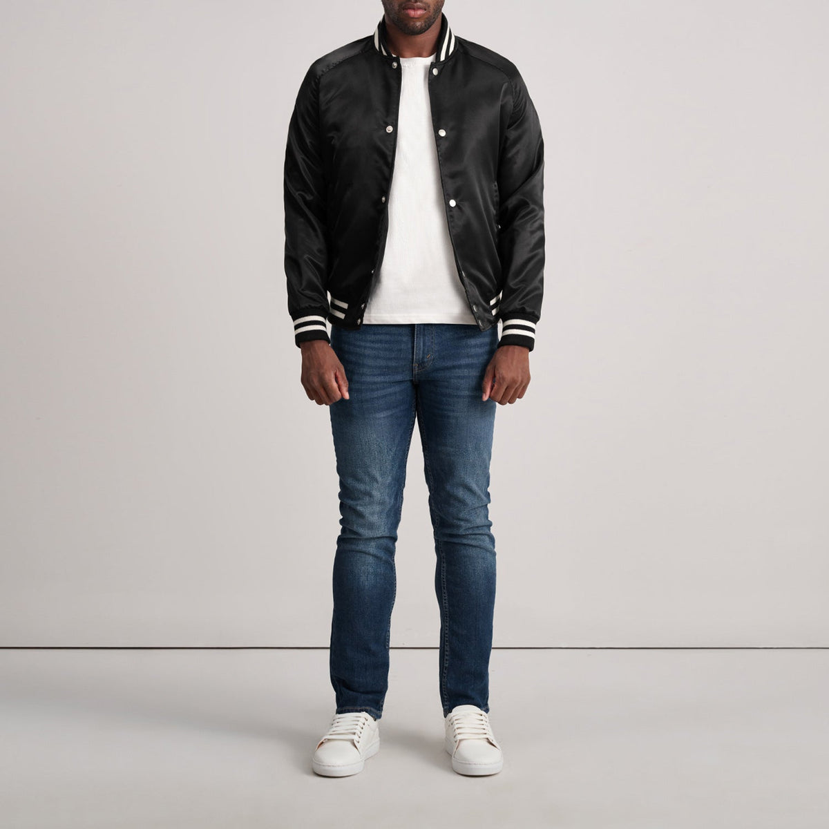 Close-Up Detail of Varsity & Button Hardware on Xander Black Varsity Jacket